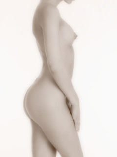 Nude woman in profile.