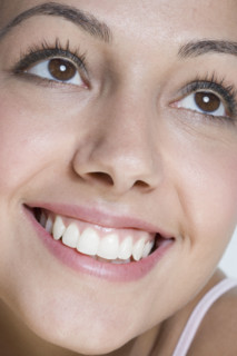 Closeup of smiling woman.