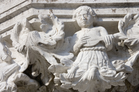 Column sculpture on Doges' Palace Venice Italy.