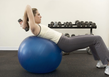Woman using exercise ball.