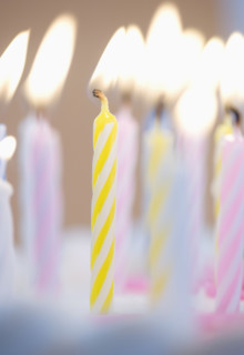 Lit candles on a cake.