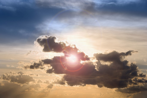 Sunset through clouds.