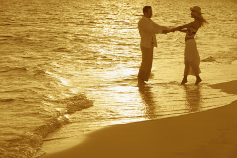 Romantic couple on beach.