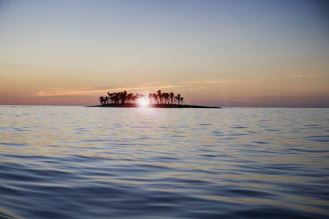 Sunset over tropical island.
