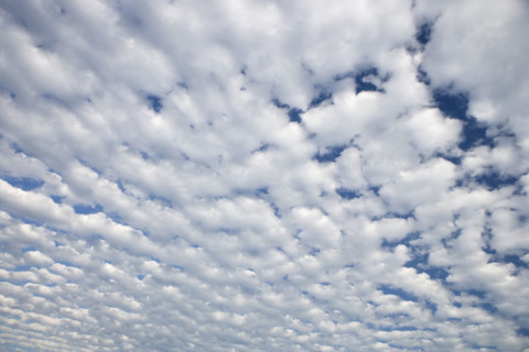 White clouds covering blue sky.