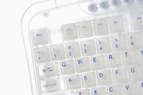 Closeup of corner of transparent keyboard.