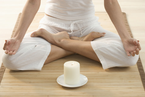Torso of person doing yoga.