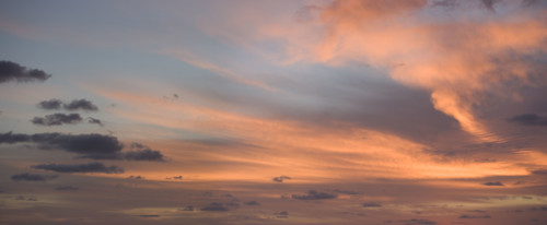 Sunlight from behind clouds.