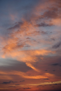 Sunlight from behind clouds.