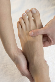 Foot being massaged.