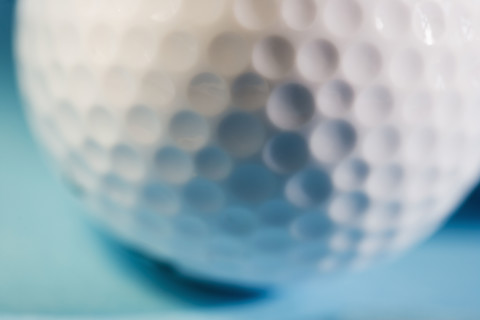 Closeup of a golf ball.