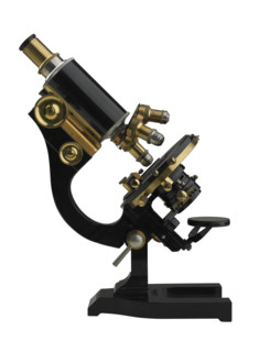 An old fashioned microscope.