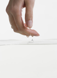 Hand touching water.