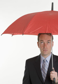 Man holding an umbrella.