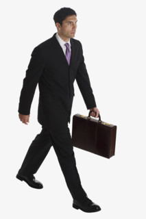 Businessman carrying briefcase.