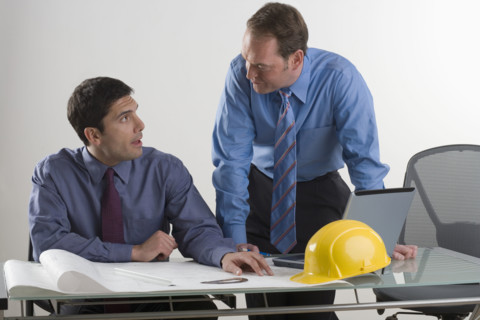 Two contractors in a meeting.