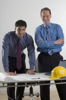 Portrait of two contractors.