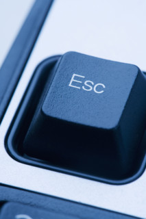 Closeup of escape key on keyboard.