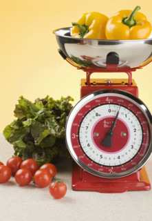 Still life of scale and produce.