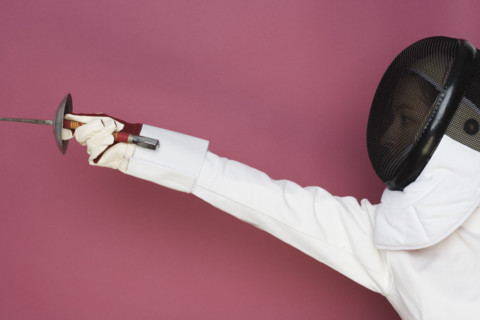 Person engaged in fencing.
