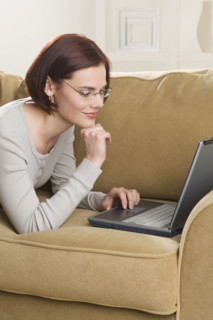 Woman at home using computer.