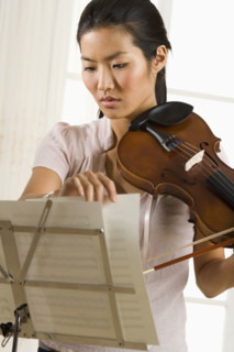 Woman playing the violin.