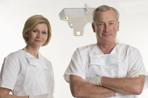 Portrait of dentist with dental hygienist.