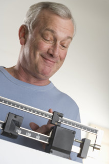 Man weighing himself.
