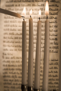 Lighting a menorah.