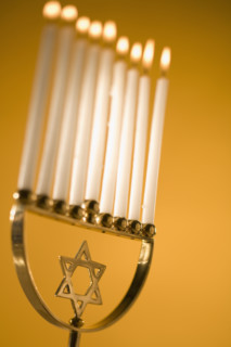 A fully lit menorah.