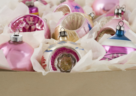 A box of Christmas ornanaments.