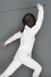 Person engaged in fencing.