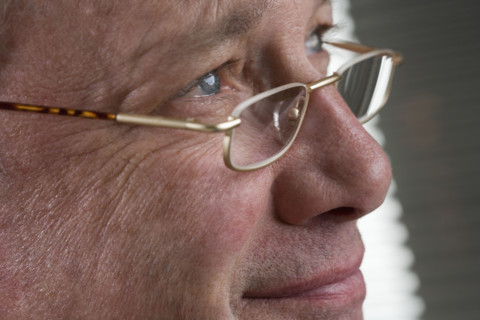 Portrait of man with glasses.