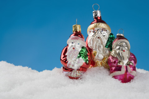 Three Santa Claus Christmas ornanaments.