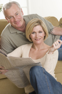 Portrait of couple relaxing at home.