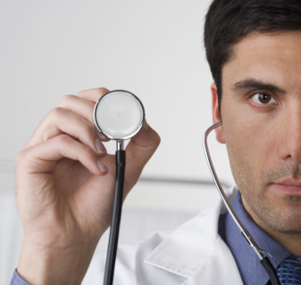 Doctor holding stethoscope.