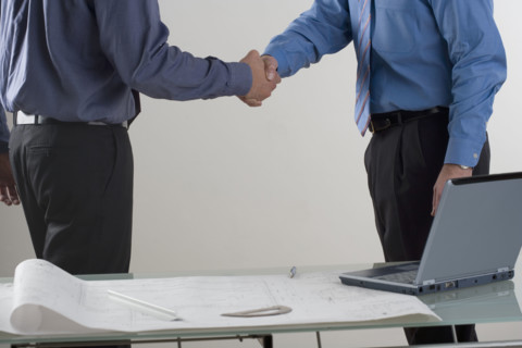 Two men shaking hands.