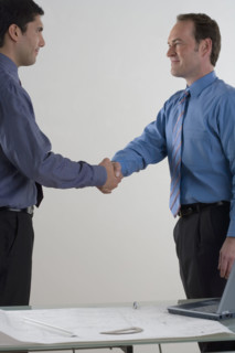 Two men shaking hands.