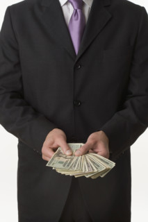 Man holding American money.