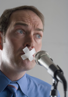 Man prevented from speaking.