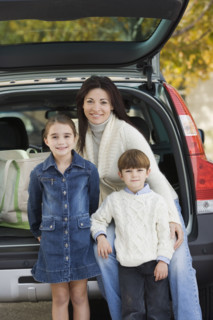 Portrait of mother with son and daughter.