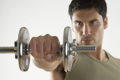 Man using free weights.