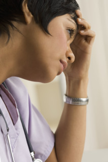 Profile view of a female health practitioner.