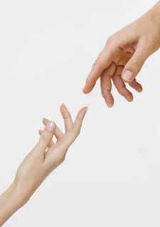 Two hands about to touch.
