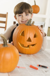Young boy with a jack o lantern.