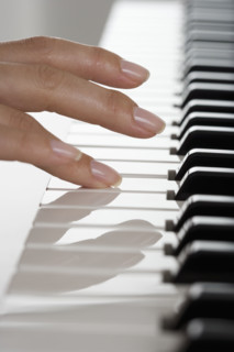 Fingers playing piano.