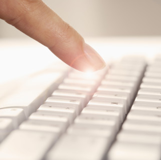 Finger and computer keyboard.
