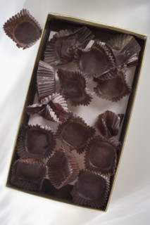 Empty candy box with wrappers.