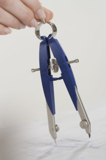 Woman using a protractor.