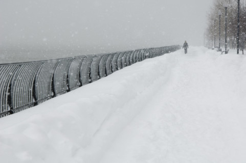 Person walking outdoors in a snowstorm.